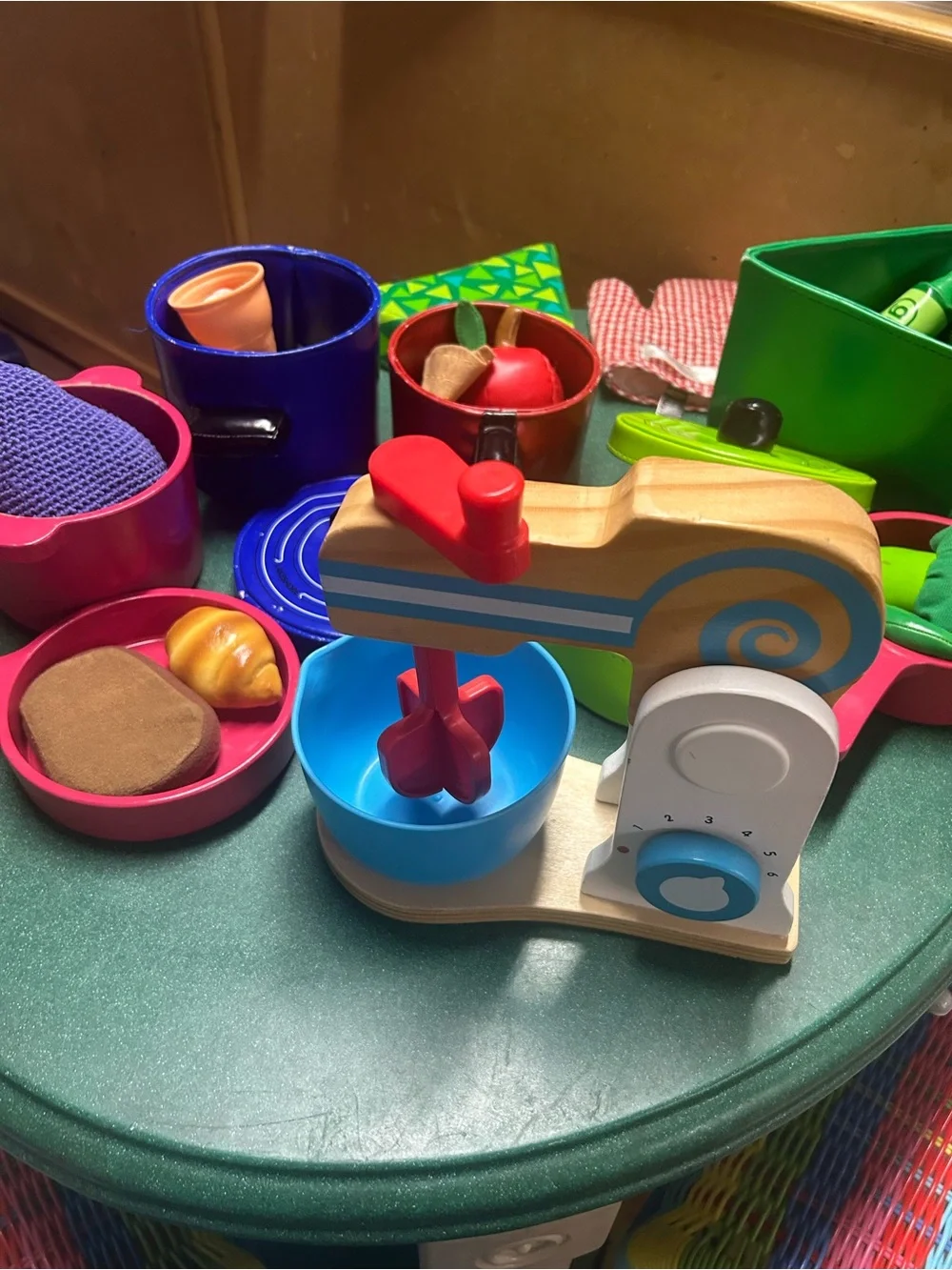 Kitchen play- colorful pans, food and wooden mixer